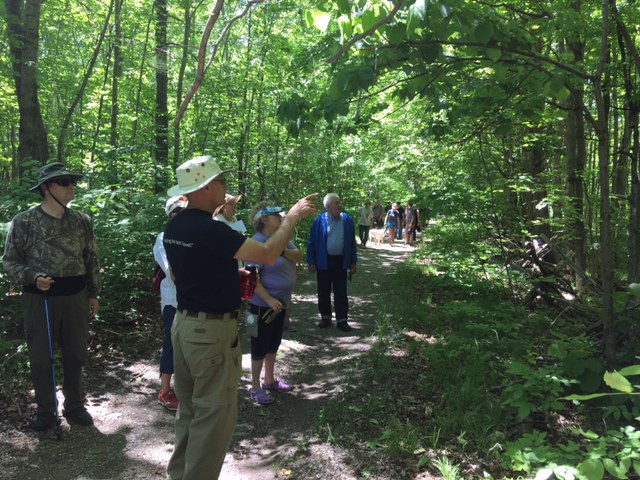 KLT Volunteer Ian Deslauriers pointing out interesting features along the Chase Trails​